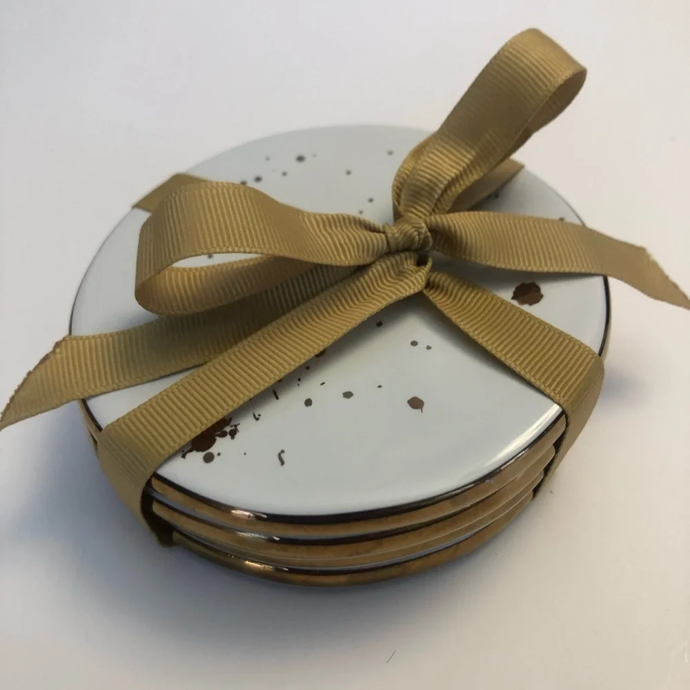 Ceramic coasters with gold trim and gold flecks